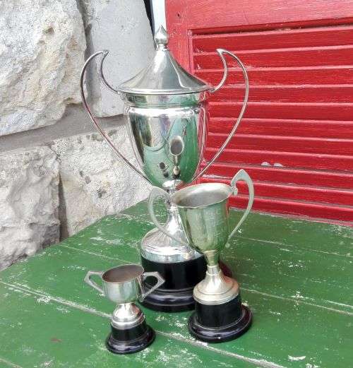 THREE SILVER PLATED TROPHIES